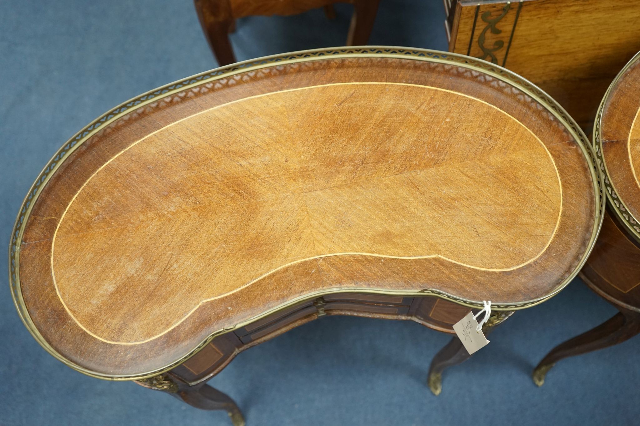 A pair of Louis XV design galleried kidney shaped occasional tables, width 59cm, depth 29cm, height 71cm